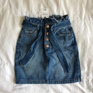Denim mini skirt with brass colored buttons